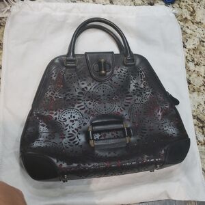 Alexander McQueen Elegant Black and Red Laser-Cut Handbag